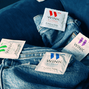 Full range of Wink Product wrappers on denim